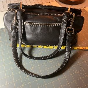 Leather shoulder bag in good condition. The side pieces have magnetic closures.